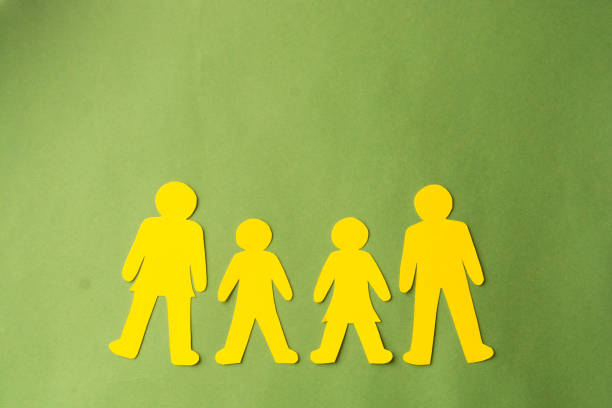 istock Family paper cut silhouette. Adoption, inclusion concept. 1299346348