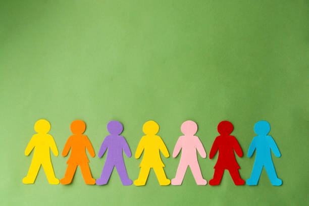 istock Paper colorful peoples, inclusion, community concept. Green background. 1299346922
