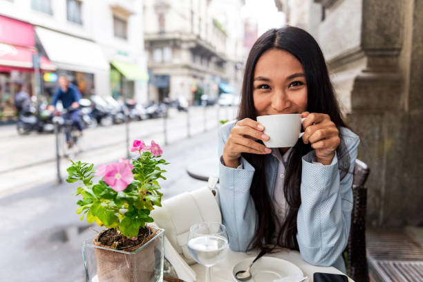 istock Beautiful Asian woman at cafe 1299346986