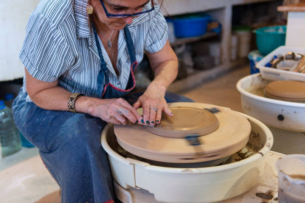 istock Senior woman in ceramics workshop 1299347016