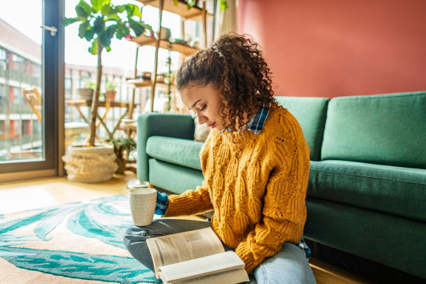 istock Relaxing with a good book and coffee at home 1299349059