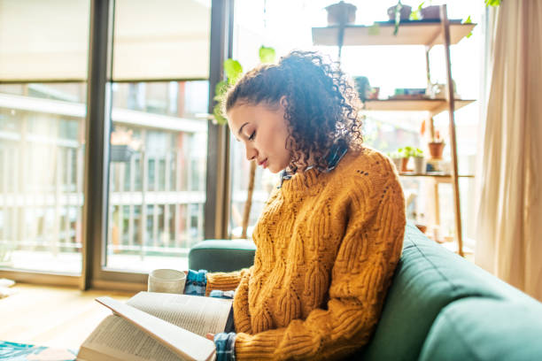 istock Relaxing with a good book and coffee at home 1299349065