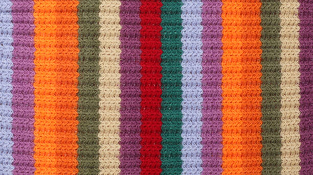 background of handmade multicolor crochet squares with different crochet borders