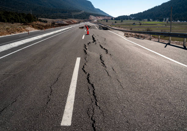 Asphalt road collapsed and cracks in the roadside