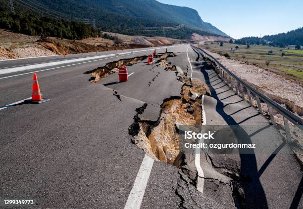 Asphalt Road Collapsed And Cracks In The Roadside Stock Photo - Download Image Now - Earthquake, Road, Broken