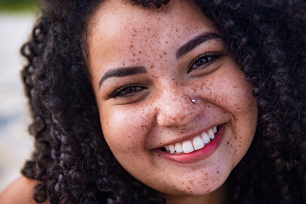 istock Brazilian woman with a curly hair 1299349829