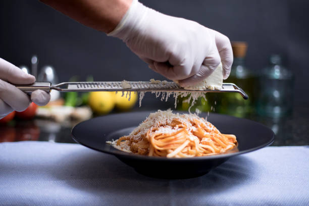 istock spaghetti plate with cheese grater 1299350713