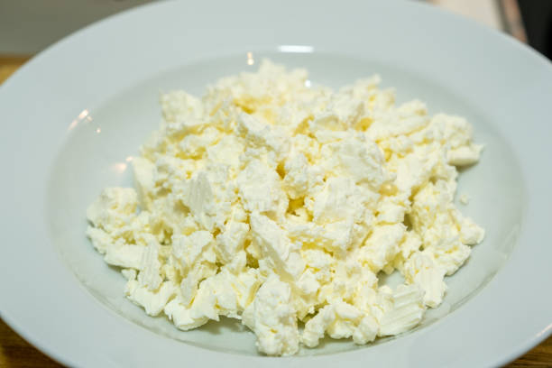 istock Crumbly feta cheese in a white plate 1299350761