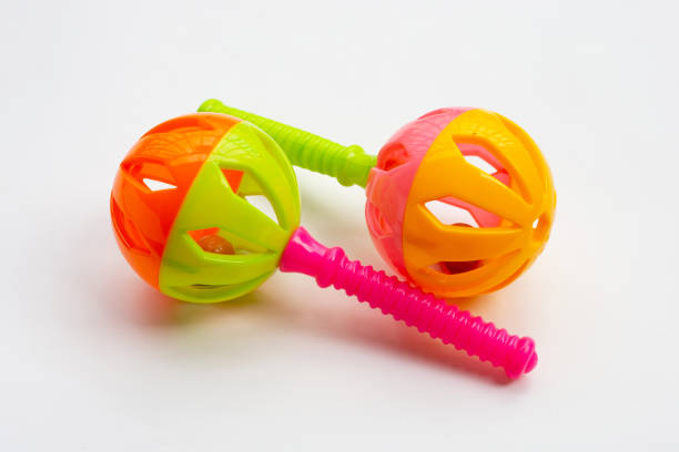 istock Colorful baby rattles on white 1299352409