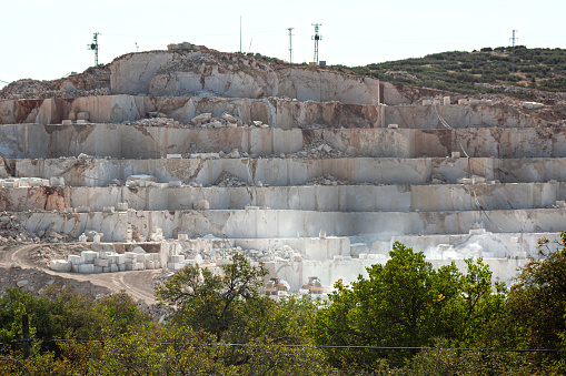 View of a marble quarry all over a hill.