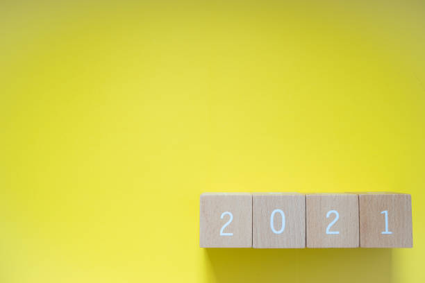 istock 2021; Four wooden blocks with 2021 text of concept. 1299354773