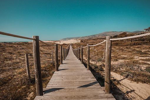 Wooden pathway over the dunes in Cascais, Lisbon, Portugal
