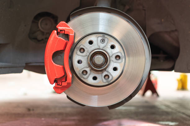 istock frontal brakes of a small car painted in red 1299354880