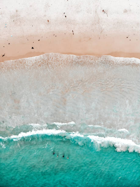 istock Aerial view over Merry Beach water and sand 1299360034