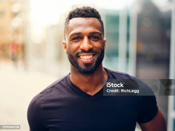 Fit Man Standing Outdoors In A City Stock Photo - Download Image Now - Men, African-American Ethnicity, African Ethnicity