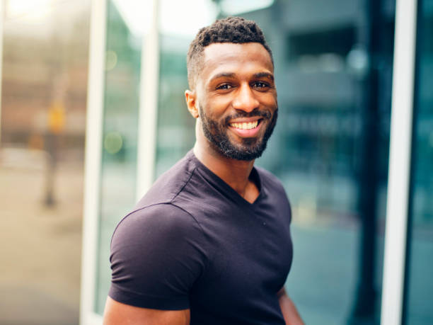 istock Fit Man Standing Outdoors in a City 1299360141