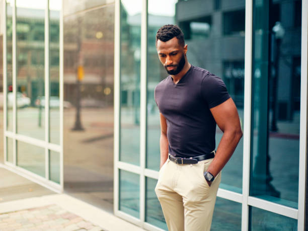 istock Fit Man Standing Outdoors in a City 1299360150
