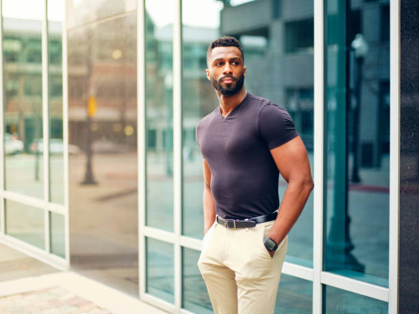 istock Fit Man Standing Outdoors in a City 1299360154