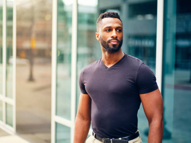 istock Fit Man Standing Outdoors in a City 1299360156