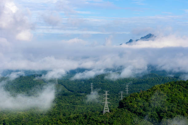 istock Electricity Pylon in fog on mountain 1299365359