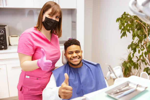 istock Young African-American man at dental office 1299371292