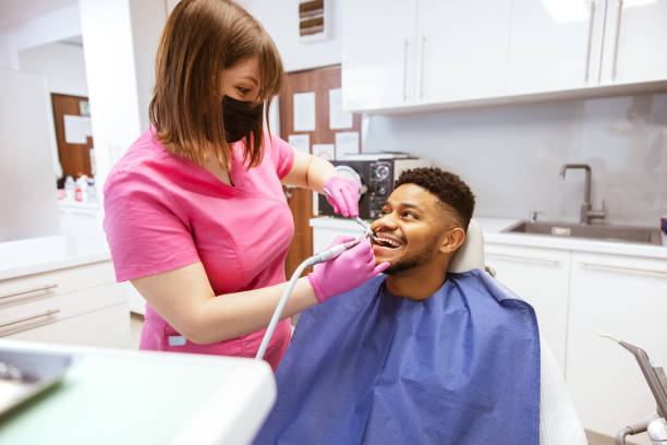 istock Young African-American man at dental office 1299371415