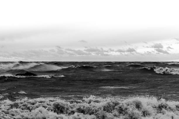 istock Crashing waves in black and white 2 1299373133