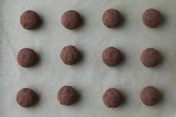 istock chocolate truffles on silver plate on wooden table 1299376305