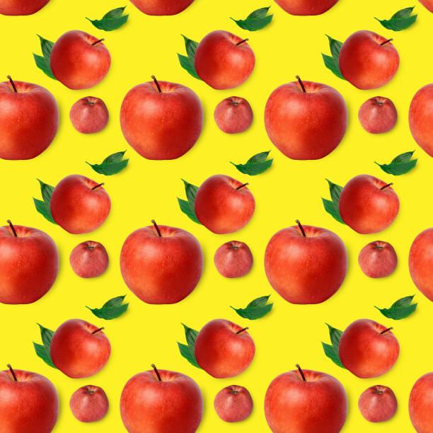 istock Red apples on a yellow background, color 2021. Seamless pattern, collage. 1299377949