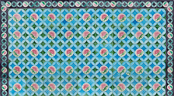 Rows of antique Nyonya Tiles with pink flowers. Vintage wall tile in penang.