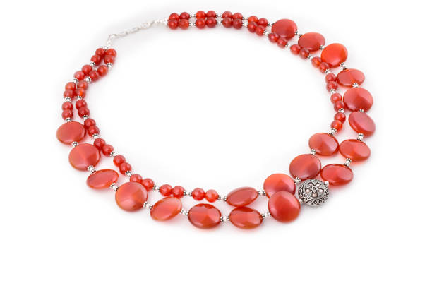 istock Red beads necklace isolated on white background, semi precious jewelry 1299380290