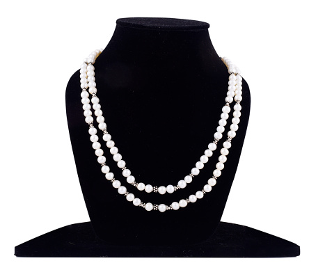 Front view of pearl jewelry on mannequin isolated on white background with clipping path