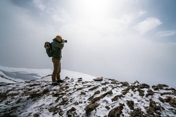 istock Taking a picture of the mountain peak 1299384014