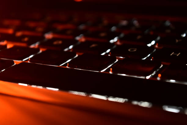 istock Traditional black keys of a keyboard with light effects 1299387373
