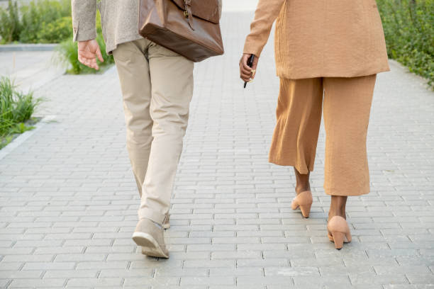 istock People walking along the street 1299394688