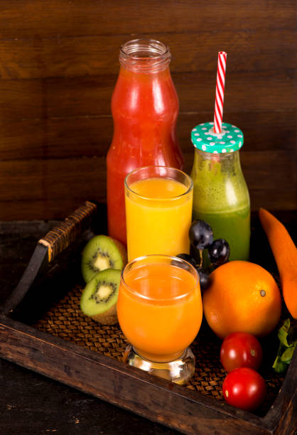 istock fruit and vegetable juices on a dark background 1299394728