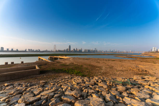 istock Sandy beach with sky in the city 1299394871