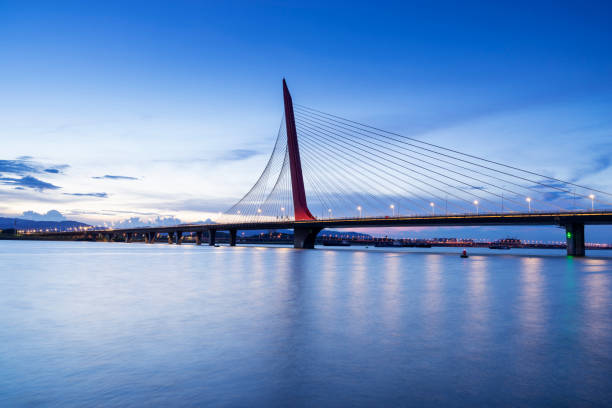 istock Modern bridge in the city at night 1299394904
