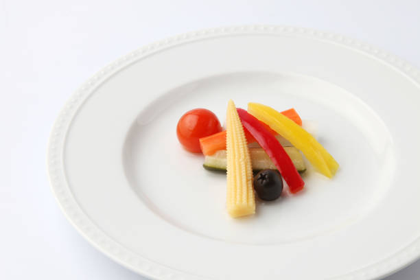 pickles pickled vegetables salad on plate isolated on white background