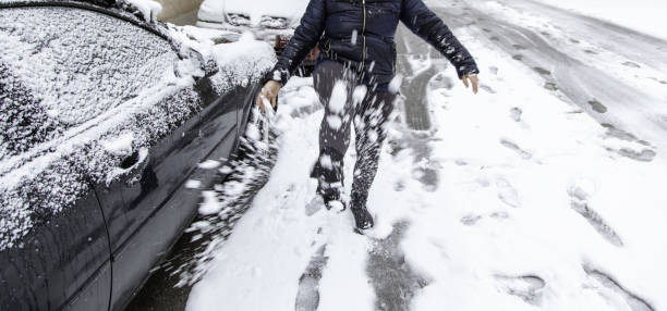 istock Woman slipping in snow 1299398278