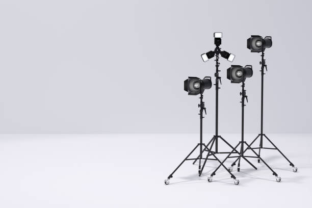 istock Photography studio flash on a lighting stand on white background 1299398857
