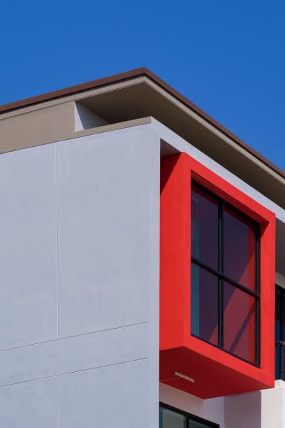 Cornice of a modern building. Red residential building roof design elements