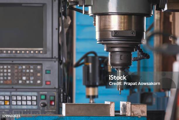 Close Up Of Cnc Milling Machine Tool With Mill In Chuck Preparing To Process Metal Detail In Manufacturing Workshop Area Stock Photo - Download Image Now