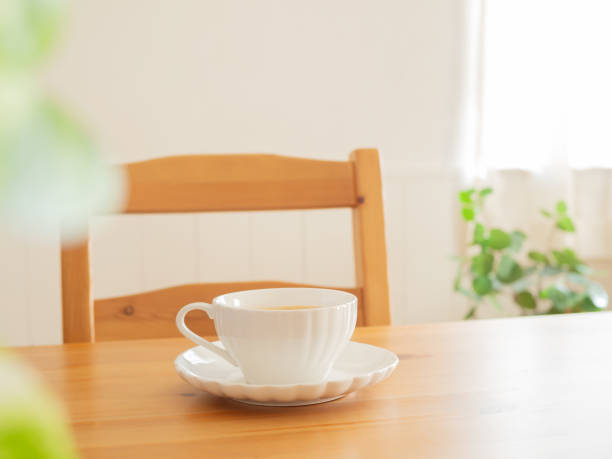 istock Cup of hot drink on wooden table 1299405973