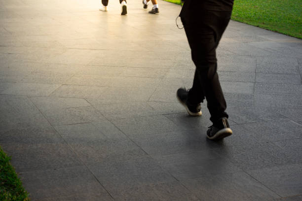 moving legs on street with motion blur effect for copy space text