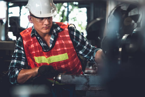 istock Smart factory worker or engineer do machine job in a manufacturing workshop 1299410974