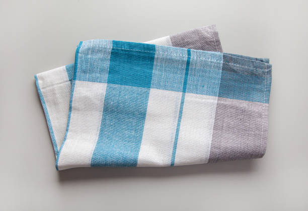 istock new folded cotton kitchen towel on grey background, top view 1299413101
