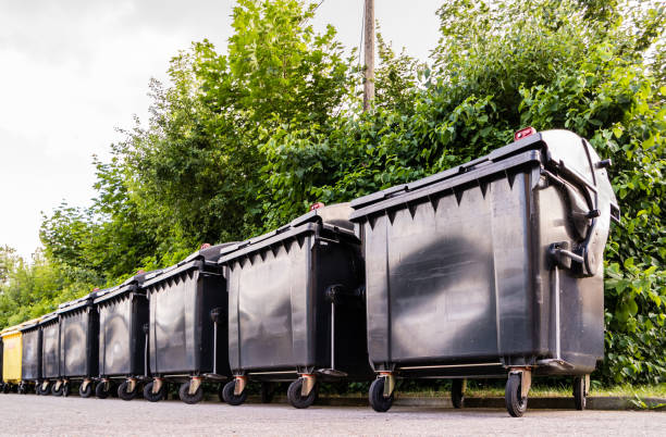 istock Black Garbage containers near apartment building 1299413808