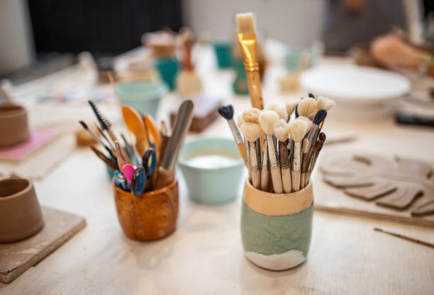 Pottery. Brushes on the table. stock photo