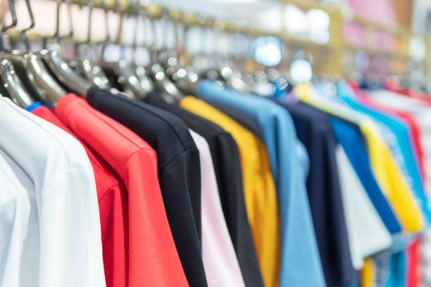 istock Colorful clothes hanging on a hanger in a store 1299415938